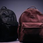 black and brown backpack on white textile